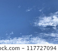 White clouds and airplane in the blue sky 117727094