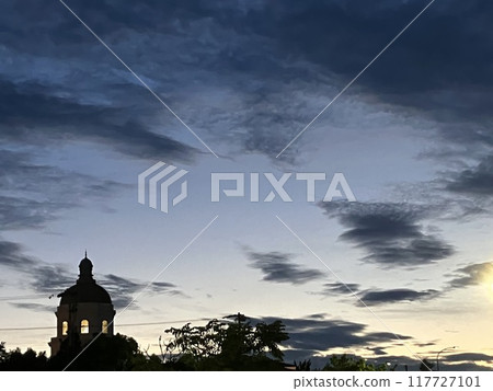 Silhouette floating in sunset Silhouette floating in sunset 117727101