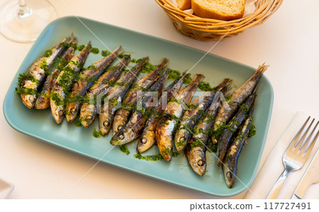 Healthy Mediterranean of fried sardines in batter served in dish Healthy Mediterranean of fried sardines in batter served in dish 117727491