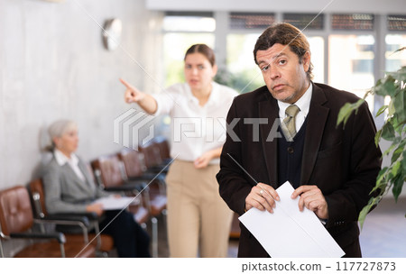 male inexperienced new employee is upset because of boss s scolding male inexperienced new employee is upset because of boss s scolding 117727873