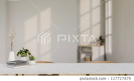 A copy space for displaying products on a white tabletop in a white room. 117727879