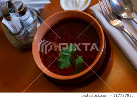 Russian dish borscht served with sour cream 117727953