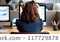 Business woman holding her head in front of a computer 117729878