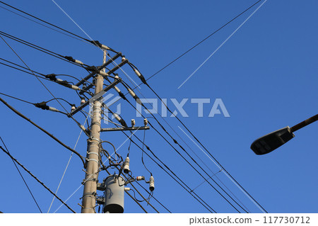 Blue sky and telephone pole Blue sky and telephone pole 117730712
