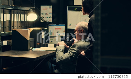 Paralyzed senior inspector reviewing classified case records in incident room, gathering intelligence for private investigation. Wheelchair user with limited mobility accessing databases. Camera A. 117730825