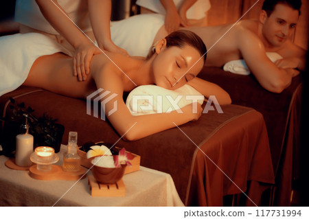 Caucasian couple customer enjoying relaxing anti-stress massage. Quiescent Caucasian couple customer enjoying relaxing anti-stress massage. Quiescent 117731994
