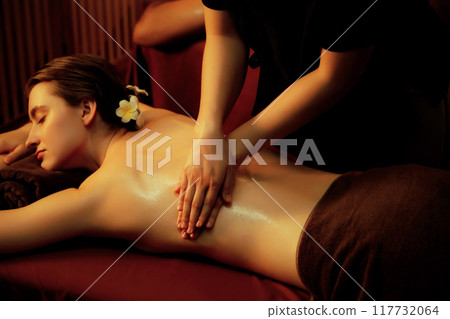 Caucasian woman customer enjoying relaxing anti-stress massage. Quiescent Caucasian woman customer enjoying relaxing anti-stress massage. Quiescent 117732064