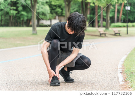A man injured his ankle while exercising in the park (gout, sprain, rehabilitation, sequelae, joint) 117732106