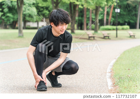 A man injured his ankle while exercising in the park (gout, sprain, rehabilitation, sequelae, joint) 117732107