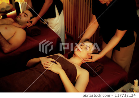 Couple customer enjoying relaxing anti-stress head massage. Quiescent Couple customer enjoying relaxing anti-stress head massage. Quiescent 117732124