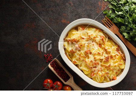 Concept of tasty and delicious homemade food - potato casserole Concept of tasty and delicious homemade food - potato casserole 117733097