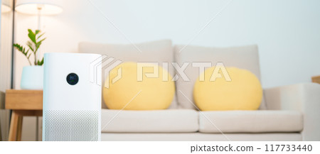 Air Purifier in cozy living room. Purification system for filter and cleaning or removing dust PM2.5 HEPA and virus in home. Allergy, Pure air, health lifestyle, Wellness life and Air Pollution 117733440