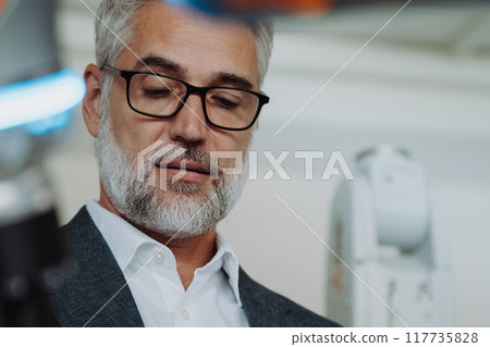 Portrait of robotics engineer in laboratory. Concept of modern technology in industries, automated processes, automotive 117735828