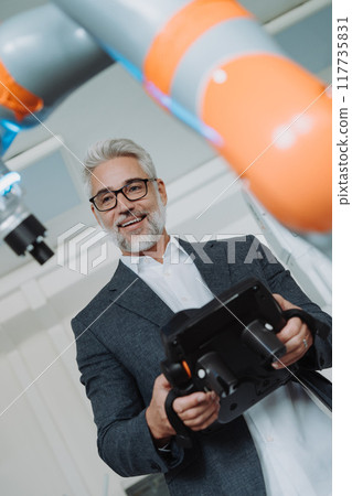 Automation, robotics engineer working on robotic knee replacement surgery project. Concept of modern technology in medicine, automated processes, healthcare. 117735831