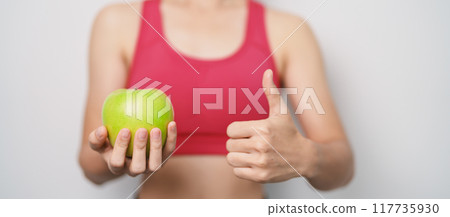 woman hand hold green Apple, happy female fitness choose fruit is Healthy food. Dieting control, Weight loss, Obesity, eating lifestyle and nutrition concepts woman hand hold green Apple, happy female fitness choose fruit is Healthy food. Dieting control, Weight loss, Obesity, eating lifestyle and nutrition concepts 117735930