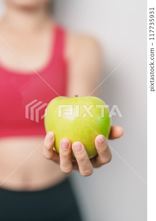 woman hand hold green Apple, happy female fitness choose fruit is Healthy food. Dieting control, Weight loss, Obesity, eating lifestyle and nutrition concepts woman hand hold green Apple, happy female fitness choose fruit is Healthy food. Dieting control, Weight loss, Obesity, eating lifestyle and nutrition concepts 117735931