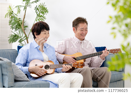Seniors playing guitar, hobbies, lessons Seniors playing guitar, hobbies, lessons 117736025