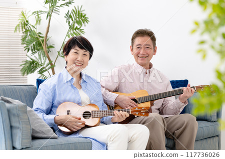 Seniors playing guitar, hobbies, lessons 117736026