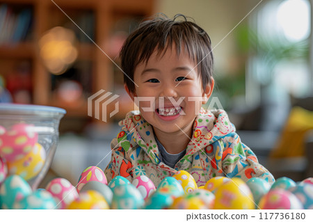 A young child is creatively adorning Easter eggs with vibrant colors.. A young child is creatively adorning Easter eggs with vibrant colors.. 117736180