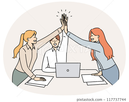 Successful business team rejoicing at completion of project, standing near desk and giving high five 117737744