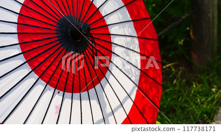 Red Japanese umbrella with silhouette Red Japanese umbrella with silhouette 117738171