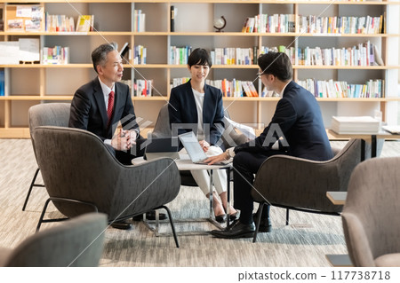 Businessmen negotiating in the lounge Businessmen negotiating in the lounge 117738718