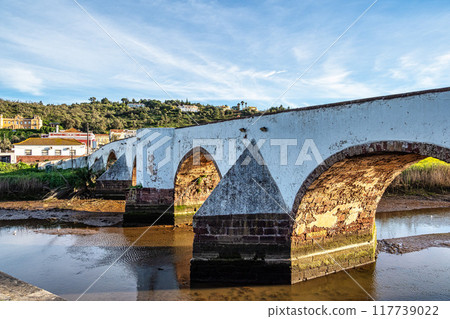 The Roman bridge, Ponte Romana in the city of Silves in the Algarve region of Portugal. The Roman bridge, Ponte Romana in the city of Silves in the Algarve region of Portugal. 117739022
