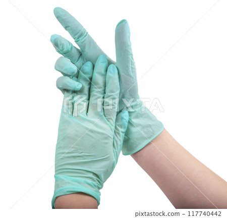 Green rubber glove on hand isolated on the white Green rubber glove on hand isolated on the white 117740442