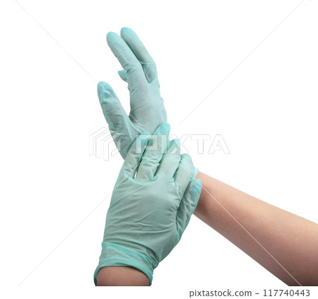 Green rubber glove on hand isolated on the white Green rubber glove on hand isolated on the white 117740443