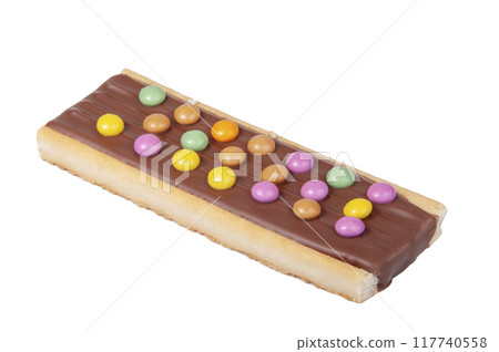 Chocolate bar snack with colorful drops or dragee isolated on the white Chocolate bar snack with colorful drops or dragee isolated on the white 117740558