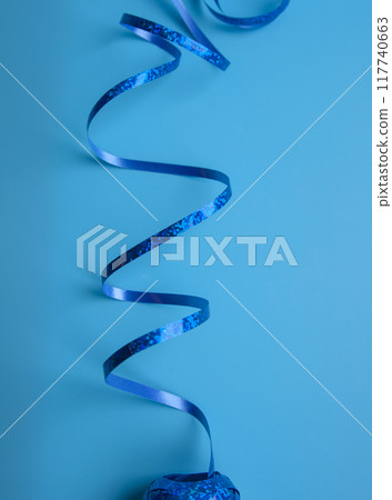 party ribbon confetti on blue 117740663