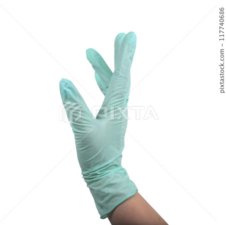 Green rubber glove on hand isolated on the white 117740686