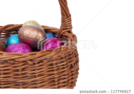 chocolate easter eggs in wooden basket isolated on the white 117740927