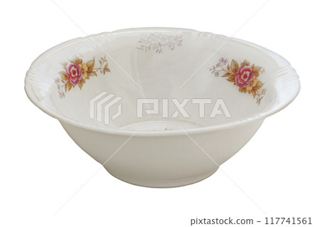 Plate with a pattern of floweres isolated on a white background. Porcelain tableware. 117741561