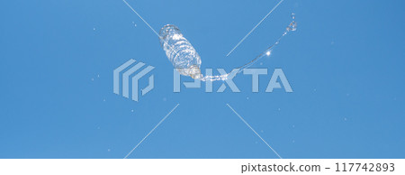 Plastic bottle overflowing with water 117742893