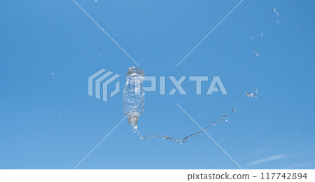 Plastic bottle overflowing with water Plastic bottle overflowing with water 117742894