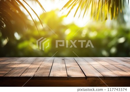 Wooden deck with tropical palm trees in background 117743374