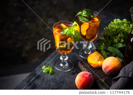 Cold ice tea with peach and mint Cold ice tea with peach and mint 117744176