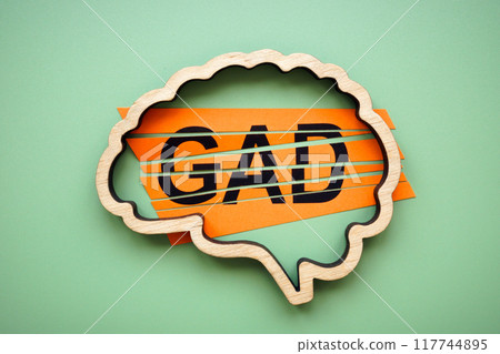 Outline of a brain with the acronym generalized anxiety disorder GAD. 117744895