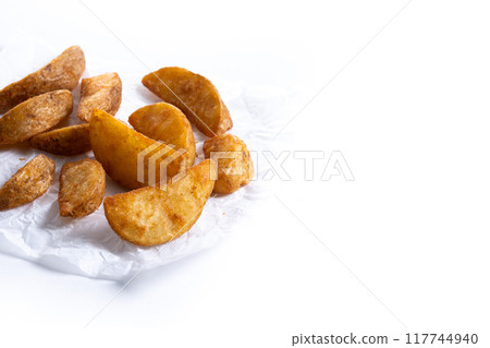 Fried potato wedges isolated on white background. Fried potato wedges isolated on white background. 117744940