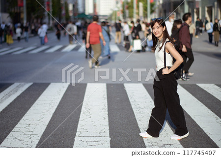 Commuting chic, Unrecognizable commuters in Tokyo, a fashionable fusion of work and personal style. Commuting chic, Unrecognizable commuters in Tokyo, a fashionable fusion of work and personal style. 117745407