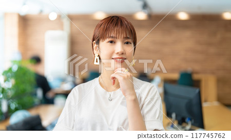Smiling young Japanese business woman Smiling young Japanese business woman 117745762