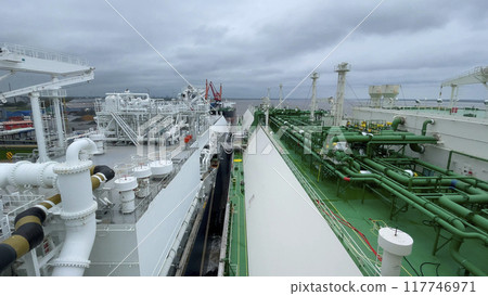 LNG ship in the terminal unloading of natural liquefied gas. Energy supply LNG ship in the terminal unloading of natural liquefied gas. Energy supply 117746971