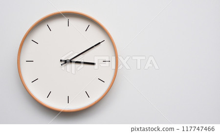 Minimalist wooden Wall Clock on White Wooden Surface with Space for Text. Time Set at 15.10/03.10 Minimalist wooden Wall Clock on White Wooden Surface with Space for Text. Time Set at 15.10/03.10 117747466