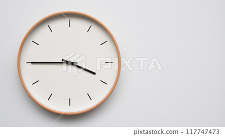 Minimalist wooden Wall Clock on White Wooden Surface with Space for Text. Time Set at 15.45/03.45 Minimalist wooden Wall Clock on White Wooden Surface with Space for Text. Time Set at 15.45/03.45 117747473