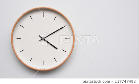 Minimalist wooden Wall Clock on White Wooden Surface with Space for Text. Time Set at 16.10/04.10 Minimalist wooden Wall Clock on White Wooden Surface with Space for Text. Time Set at 16.10/04.10 117747498