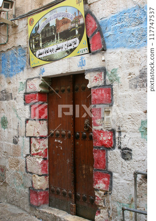 Door with Islamic Hajj painting in the Muslim quarter of the old city, Jerusalem, Israel 117747537