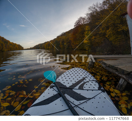 Paddleboarding on a Serene Autumn Lake Paddleboarding on a Serene Autumn Lake 117747668