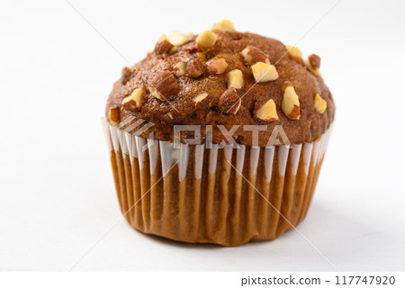 Chocolate almond muffin on white background 117747920