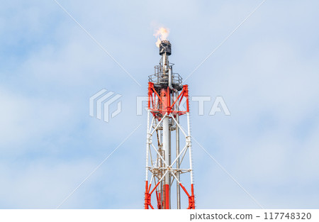 A steel tower that raises a flare stack (flame) 117748320